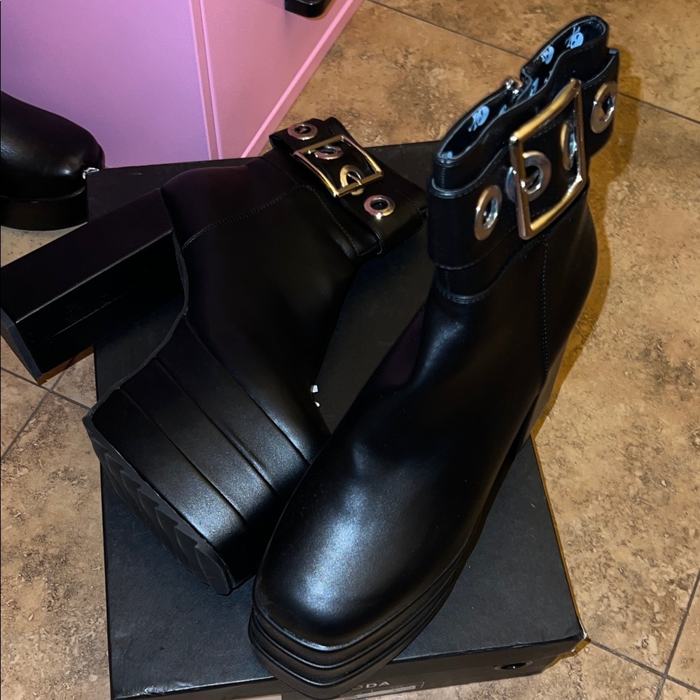 Sleek Black Heeled Boots with Buckle Detail